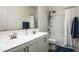 Bathroom features double sinks, modern fixtures, and a shower-tub combination at 1953 W Kinfield Trl, Phoenix, AZ 85085