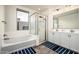 Bright bathroom features large tub, glass shower, and double sink vanity at 1953 W Kinfield Trl, Phoenix, AZ 85085
