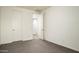 Bedroom features neutral carpet, white walls, and ample closet space at 1953 W Kinfield Trl, Phoenix, AZ 85085