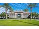 Elegant building exterior surrounded by lush green lawns and majestic palm trees on a sunny day at 1953 W Kinfield Trl, Phoenix, AZ 85085