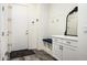 Charming entryway features built-in bench with storage and coat hooks at 1953 W Kinfield Trl, Phoenix, AZ 85085