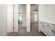 Hallway with built-in storage leads to bedrooms and adds a touch of elegance at 1953 W Kinfield Trl, Phoenix, AZ 85085