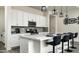 Modern kitchen features sleek countertops, stainless steel appliances, and a convenient breakfast bar at 1953 W Kinfield Trl, Phoenix, AZ 85085