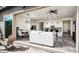 Open-concept living area features modern design, tile floors, and seamless indoor-outdoor flow at 1953 W Kinfield Trl, Phoenix, AZ 85085