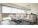 Open-concept living room features comfortable seating, bright windows, and modern design at 1953 W Kinfield Trl, Phoenix, AZ 85085