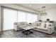 Inviting living room features modern lighting, plush seating, and elegant area rug at 1953 W Kinfield Trl, Phoenix, AZ 85085