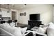 Bright living room boasts sleek entertainment center, accent decor, and contemporary furnishings at 1953 W Kinfield Trl, Phoenix, AZ 85085
