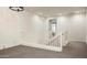 Bright loft area with neutral carpet and white railing overlooks the entry at 1953 W Kinfield Trl, Phoenix, AZ 85085
