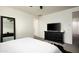 Airy bedroom features ample space, with walk-in closet, and natural light at 1953 W Kinfield Trl, Phoenix, AZ 85085