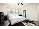 Relaxing bedroom with cozy decor, large window, and ample closet space at 1953 W Kinfield Trl, Phoenix, AZ 85085