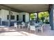 Outdoor kitchen and dining area with a grill and comfortable seating for gatherings at 1953 W Kinfield Trl, Phoenix, AZ 85085