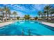 Resort-style pool with lounge chairs, palm trees, and cabanas offers a relaxing outdoor experience at 1953 W Kinfield Trl, Phoenix, AZ 85085