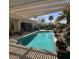 Inviting outdoor pool area with ample seating and a serene backyard at 2120 N 166Th Dr, Goodyear, AZ 85395