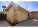 Spacious two car garage and side yard featuring stone accents at 2135 W Vineyard Rd, Phoenix, AZ 85041