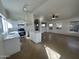 Spacious kitchen with white cabinets and stainless steel appliances that opens to a living space perfect for entertaining at 21443 N 29Th Dr, Phoenix, AZ 85027