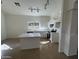 Bright kitchen with white cabinets, quartz countertops, stainless steel appliances and center island at 21443 N 29Th Dr, Phoenix, AZ 85027