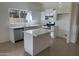Bright kitchen with white cabinetry, stainless steel appliances and a center island, perfect for Gathering meals and entertaining at 21443 N 29Th Dr, Phoenix, AZ 85027