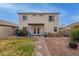 Spacious backyard featuring a patio, lawn, and fire pit, ideal for outdoor enjoyment at 22644 W Mohave St, Buckeye, AZ 85326