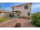 View of the home's backyard with patio, blue seating, and a fire pit area at 22644 W Mohave St, Buckeye, AZ 85326