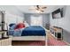 Bright bedroom with a large bed, ceiling fan, and stylish furniture, creating a relaxing retreat at 22644 W Mohave St, Buckeye, AZ 85326