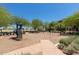 Community playground with various play structures and seating areas for residents at 22644 W Mohave St, Buckeye, AZ 85326