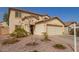 Inviting two-story home featuring a two-car garage and desert landscaping at 22644 W Mohave St, Buckeye, AZ 85326