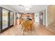 Open kitchen and dining area with wood cabinets and stainless steel appliances at 22644 W Mohave St, Buckeye, AZ 85326