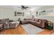 Comfortable living room with a plush sectional sofa and a ceiling fan at 22644 W Mohave St, Buckeye, AZ 85326