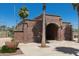 Brick building with an archway at Redmond Field, located next to a sports field at 22644 W Mohave St, Buckeye, AZ 85326
