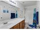 Cheerful bathroom with a single sink vanity, tub, and vibrant kid-friendly decorations at 28014 N Jade St, San Tan Valley, AZ 85143