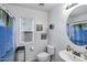 This bathroom has a toilet, sink, and shower curtain, along with bright white walls at 28014 N Jade St, San Tan Valley, AZ 85143