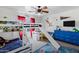 Fun bedroom with bunk beds, slide, and rocket wall decor at 28014 N Jade St, San Tan Valley, AZ 85143