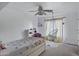 Relaxing bedroom with a hanging macrame chair, butterfly rug, and soft, natural light at 28014 N Jade St, San Tan Valley, AZ 85143