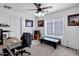Comfortable bedroom with a ceiling fan, natural light, and a cozy atmosphere at 28014 N Jade St, San Tan Valley, AZ 85143