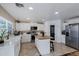 Bright kitchen featuring white cabinetry, stainless steel appliances, and a butcher block island at 28014 N Jade St, San Tan Valley, AZ 85143
