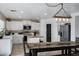 Bright kitchen with white cabinets, stainless steel appliances, and a large island at 28014 N Jade St, San Tan Valley, AZ 85143