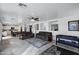 Open living space featuring tile floors, comfortable sofas, and a foosball table at 28014 N Jade St, San Tan Valley, AZ 85143