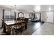 Open-concept living and dining area with hardwood floors, stylish furniture and decor at 28014 N Jade St, San Tan Valley, AZ 85143