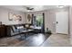 Comfortable living room with large sectional sofa, neutral colors and ample natural light at 28014 N Jade St, San Tan Valley, AZ 85143