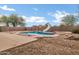 Backyard oasis featuring a refreshing pool with slide, and a gravel-covered yard at 28014 N Jade St, San Tan Valley, AZ 85143