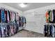 Spacious walk-in closet with ample hanging space and shelving for organized storage at 28014 N Jade St, San Tan Valley, AZ 85143