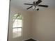 Bright bedroom with neutral walls, wood floors, and a window with views of a tree at 29673 N 120Th Ln, Peoria, AZ 85383