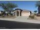 Charming single-story home featuring a well-manicured lawn and a two car garage at 29673 N 120Th Ln, Peoria, AZ 85383