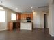 Open kitchen showcasing wood floors, a central island, and stainless steel appliances at 29673 N 120Th Ln, Peoria, AZ 85383