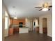 Spacious kitchen with wood cabinets, granite countertops, and a central island at 29673 N 120Th Ln, Peoria, AZ 85383