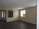 Well lit living room featuring wood floors, neutral walls, and a bright window at 29673 N 120Th Ln, Peoria, AZ 85383