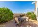 Backyard patio with seating area, brick pavers, landscaping and block wall fence at 30112 N Jillian Dr, San Tan Valley, AZ 85143