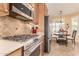 Well-equipped kitchen featuring stainless steel appliances and a breakfast nook at 30112 N Jillian Dr, San Tan Valley, AZ 85143