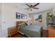 Serene bedroom with a queen-sized bed, neutral walls, and a ceiling fan, creating a comfortable and peaceful retreat at 3041 E Roma Ave, Phoenix, AZ 85016