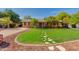 Charming single-story home with well-manicured lawn and stone walkway leading to the front entrance at 3041 E Roma Ave, Phoenix, AZ 85016